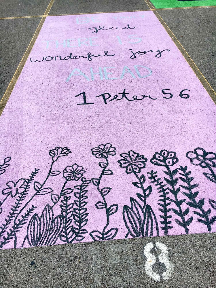 PHOTOS Lakota East seniors paint parking spots
