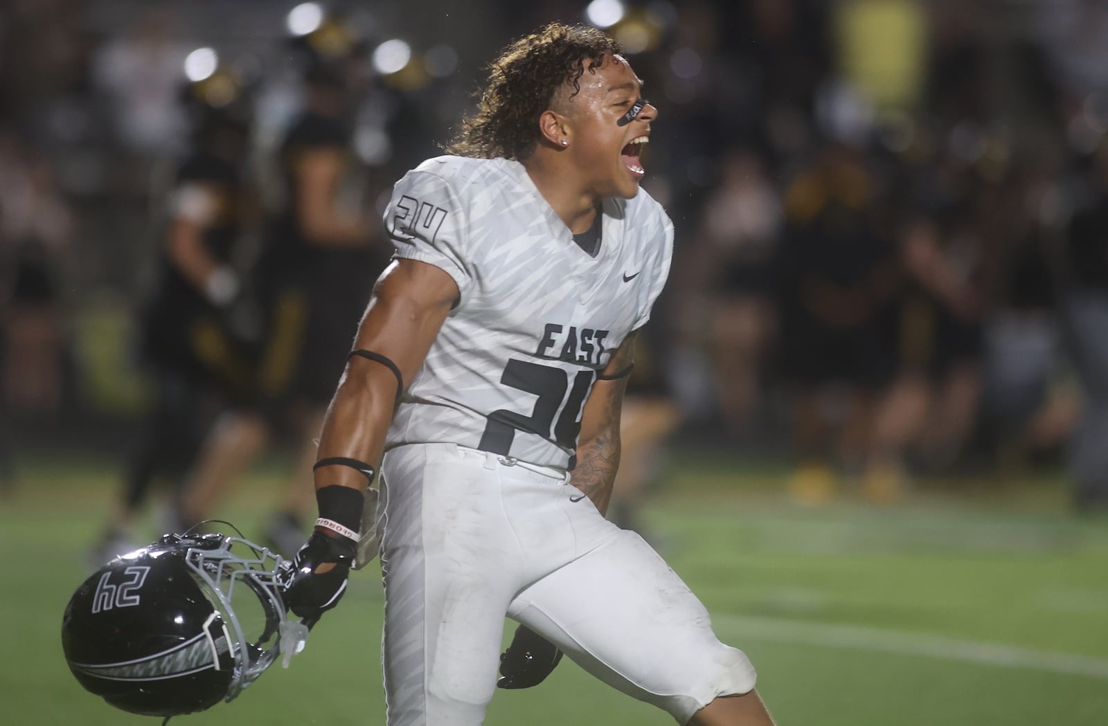 Lakota East's Ryder Hooks celebrates after a victory against Centerville on Friday, Aug. 22, 2025, at Centerville Stadium. David Jablonski/Staff