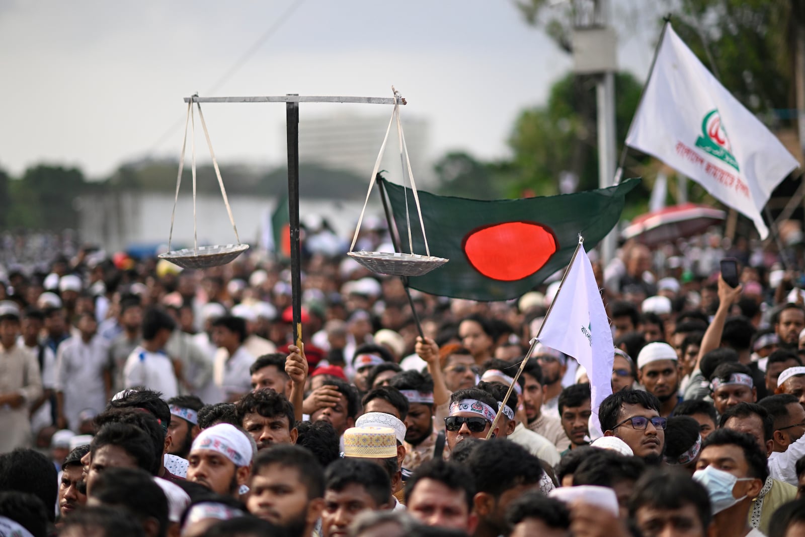 Thousands of supporters of Bangladesh's largest Islamist party Jamaat-e-Islami attend a rally in a show of strength ahead of elections expected next year, in Dhaka, Bangladesh, Saturday, July 19, 2025. (AP Photo/Mahmud Hossain Opu)
