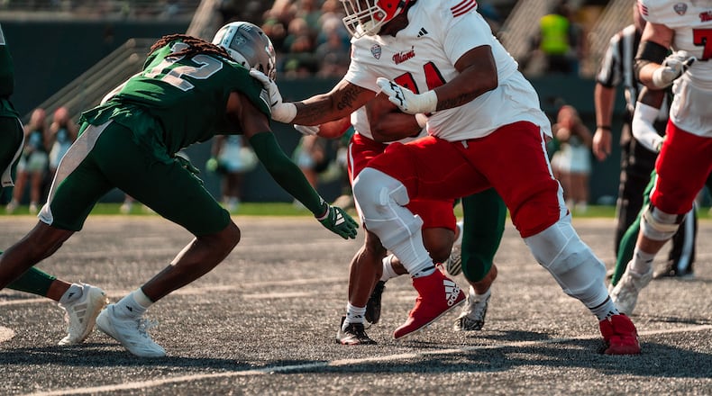 Miami's Gregory Smith Jr. (74) pass blocks against Eastern Michigan on Saturday. Miami Athletics photo