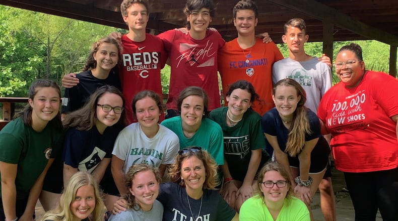 Megan Halverson, Christian service coordinator at Badin High School, is pictured with Badin students who performed community service last year at Solsberry Hill in Indiana. Four service trips planned this summer may be in jeopardy because of the coronavirus. SUBMITTED PHOTO