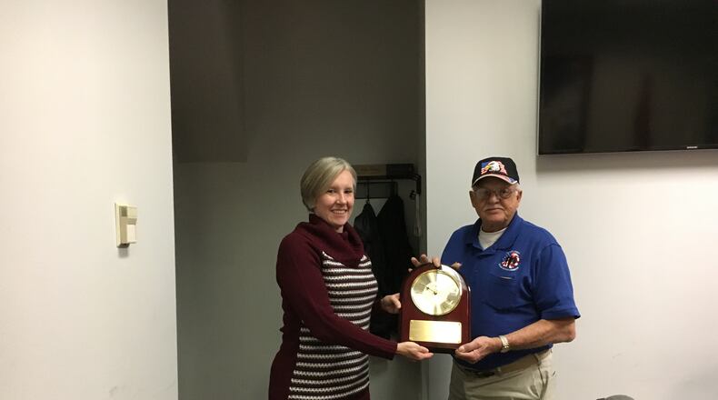 Butler County Veterans Service Commission Executive Director Caroline Bier presents retiring Commissioner Lowell Stewart with a plaque at his last meeting on the board in2017.