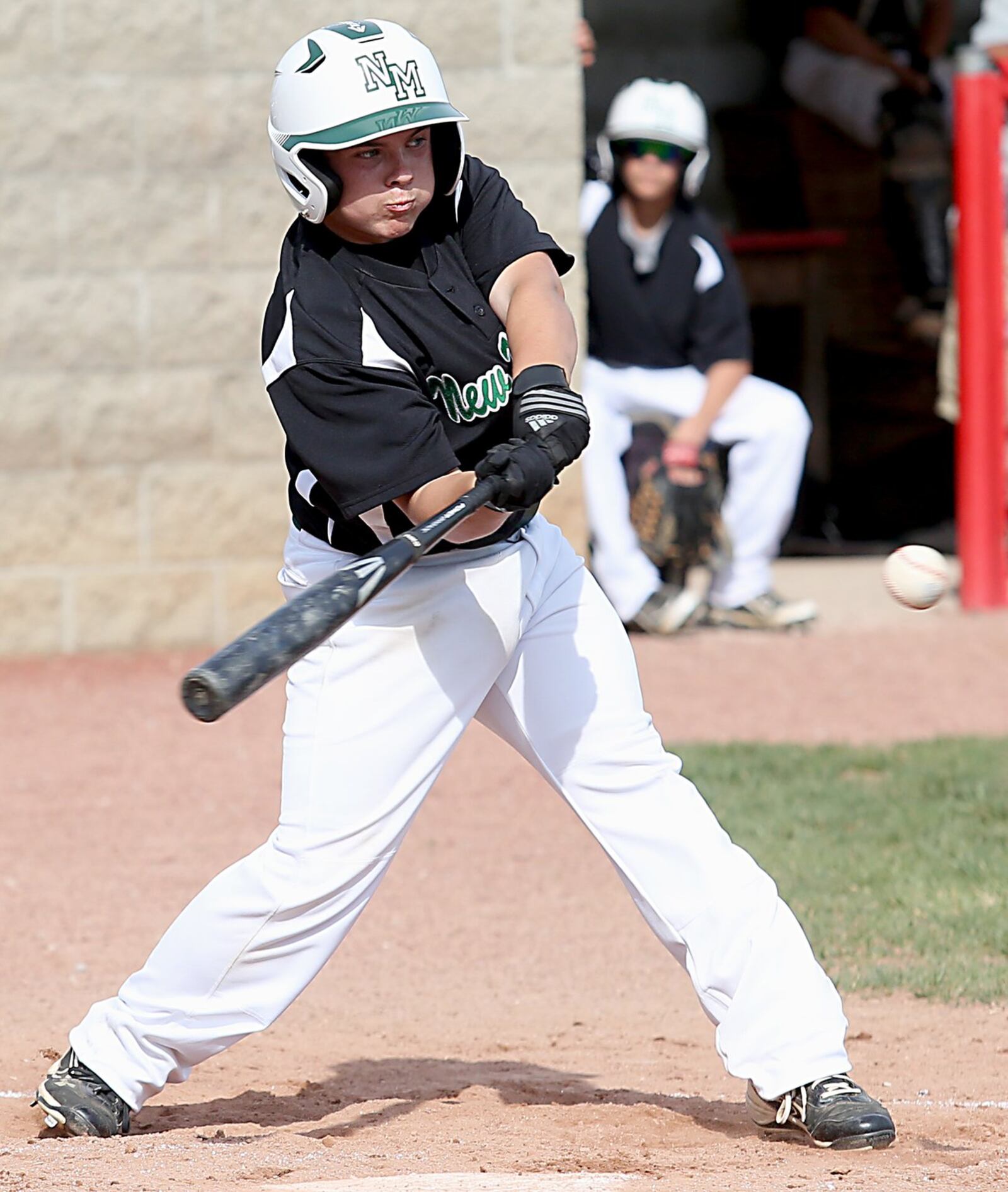New Miami’s Robby Hundley puts the bat on the ball Wednesday during a Division IV sectional final against Miami Valley Christian Academy at Kings. CONTRIBUTED PHOTO BY E.L. HUBBARD