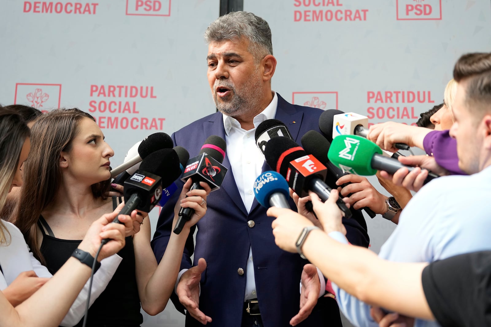 Romanian Prime Minister Marcel Ciolacu speaks to media at the PSD headquarters, in Bucharest, Romania, Monday, May 5, 2025, the day after the governing coalition's candidate failed to advance to the runoff in the presidential election rerun. (AP Photo/Andreea Alexandru)