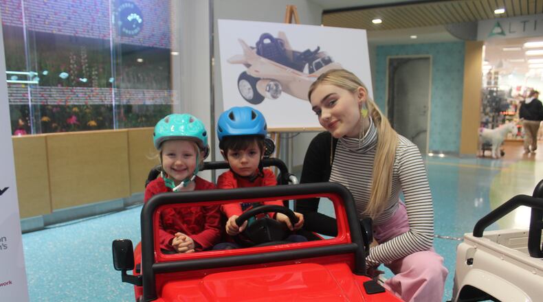 Meg Donnelly, star of ABC’s “American Housewife” and the popular Disney Channel movie “Zombies,” visited Dayton Children’s as part of the announcement of Huffy’s donation to Dayton Children's and other Children’s Miracle Network hospitals. The bicycle business donated $150,000 to Children’s Medical Network and $10,000 to Dayton Children’s. It pledged to donate battery-powered ride-ons like the one Cora Saunders, 4, and Charlie Herin, 3, are pictured in for kid’s heading into surgery to CMN’s 170 member hospitals. Photo by Amelia Robinson