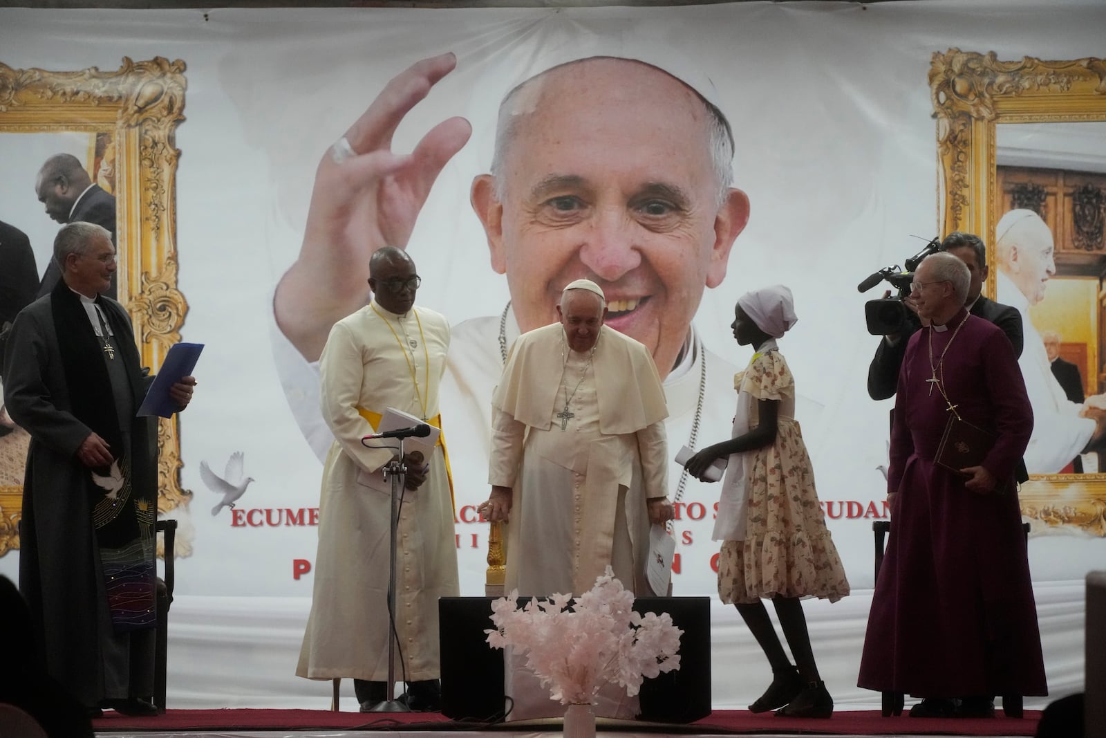 FILE - Pope Francis meets a displaced girl during a meeting with internally displaced persons at Freedom Hall in Juba, South Sudan, Feb. 4, 2023. (AP Photo/Gregorio Borgia, File)