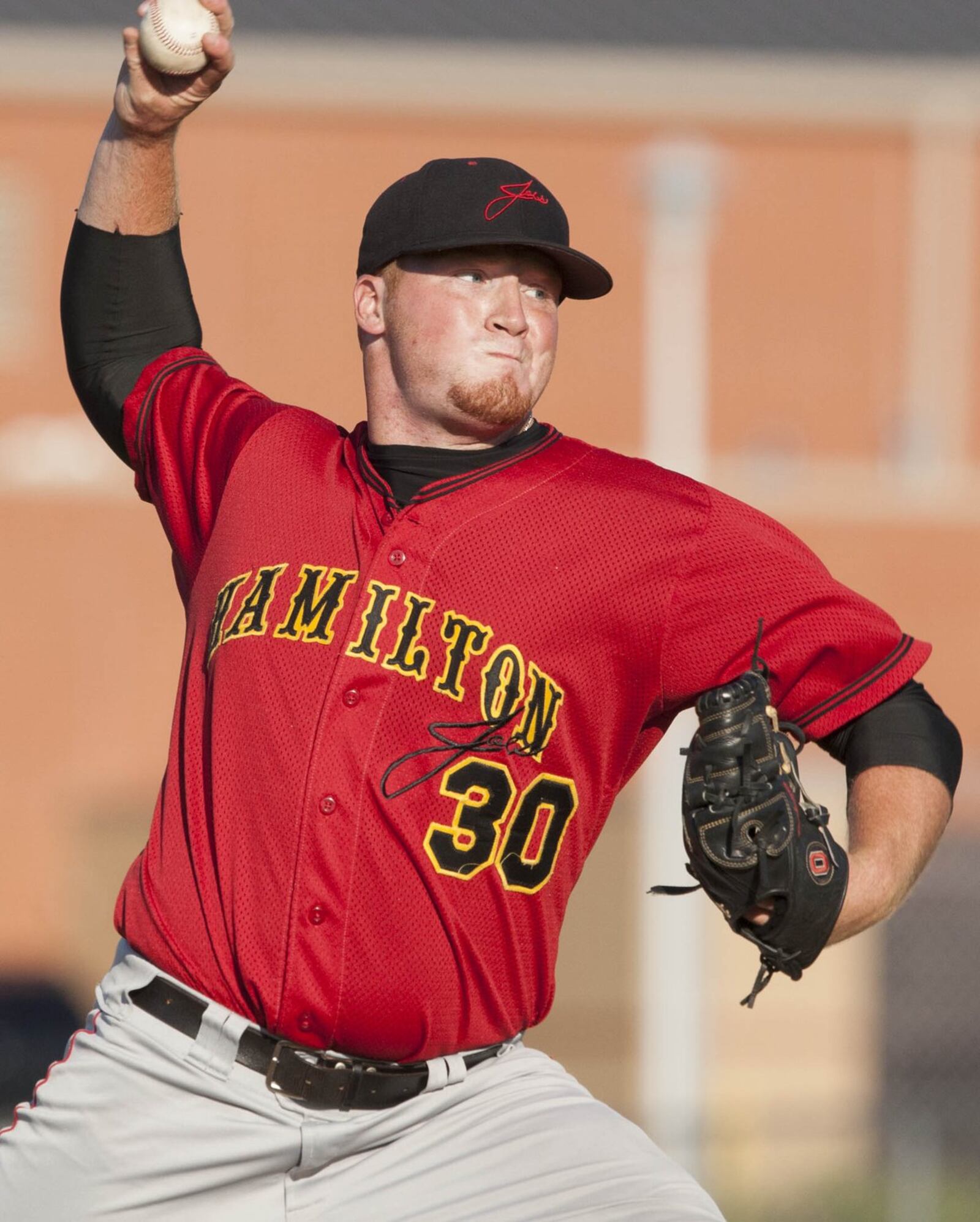 Hamilton Joes pitcher Brett McKinney delivers a pitch during a game against the Dayton Docs on June 14, 2012, at Foundation Field in Hamilton. JOURNAL-NEWS FILE PHOTO