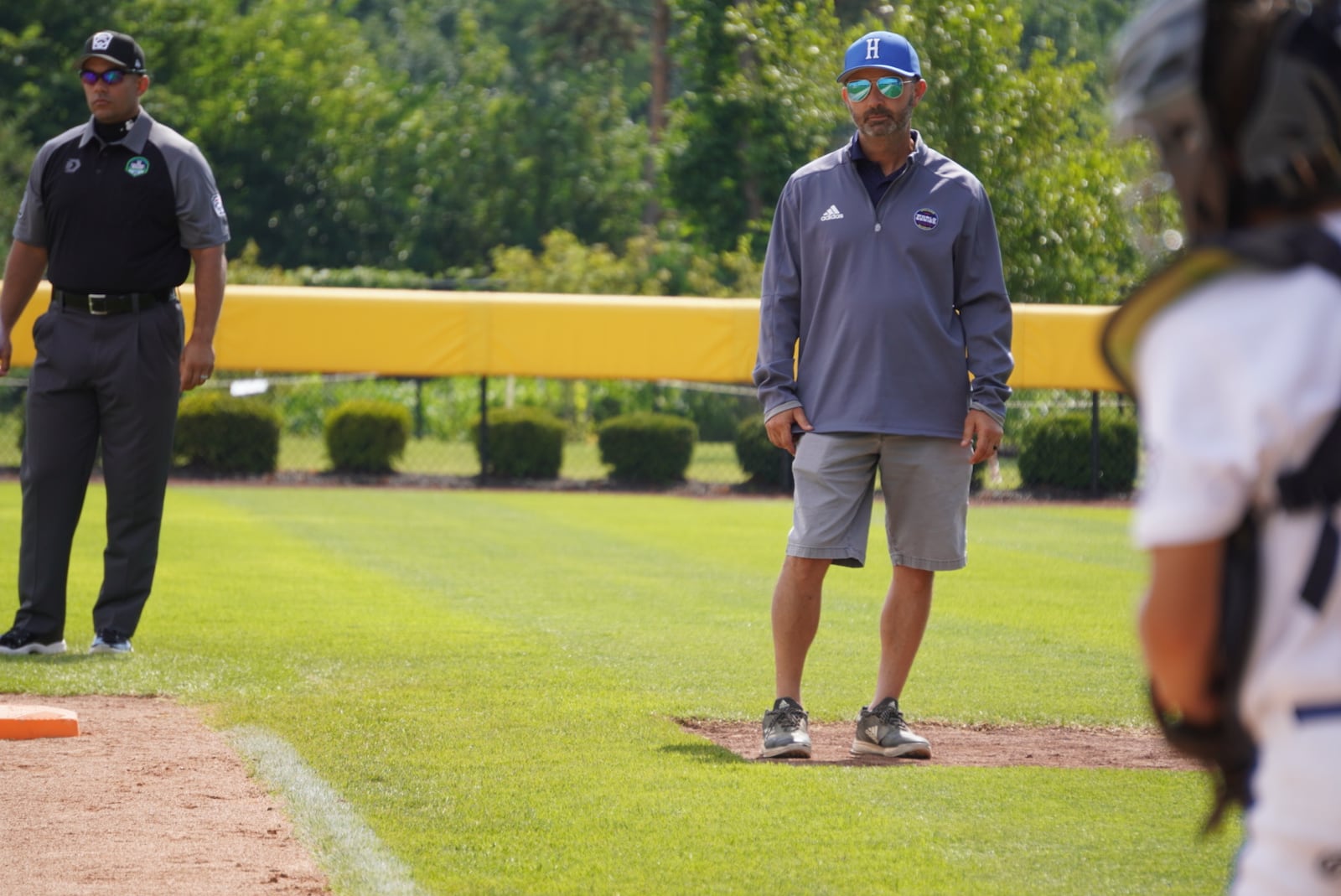 West Side Little League manager Ken Coomer surveys the field during his team's Great Lakes Region game against Kentucky on Saturday at the Little League Central Region Complex in Whitestown, Indiana. West Side won 7-0. CHRIS VOGT / CONTRIBUTED