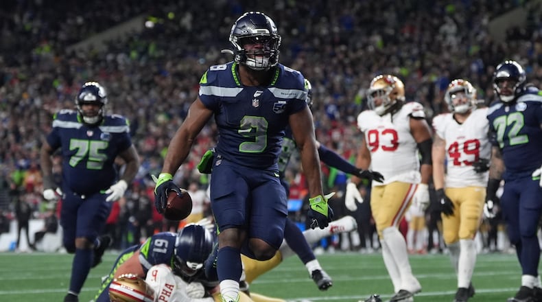 Seattle Seahawks running back Kenneth Walker III (9) scores a touchdown during the second half of an NFL football divisional playoff game against the San Francisco 49ers, Saturday, Jan. 17, 2026, in Seattle. (AP Photo/Lindsey Wasson)