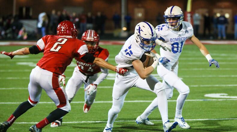 Fairfield’s Kyle Schimpf (2) goes after St. Xavier wide receiver Andrew Wittrock (12) during their Division I playoff game at Fairfield Stadium on Nov. 4, 2016. The visiting Bombers won 35-14. GREG LYNCH/STAFF