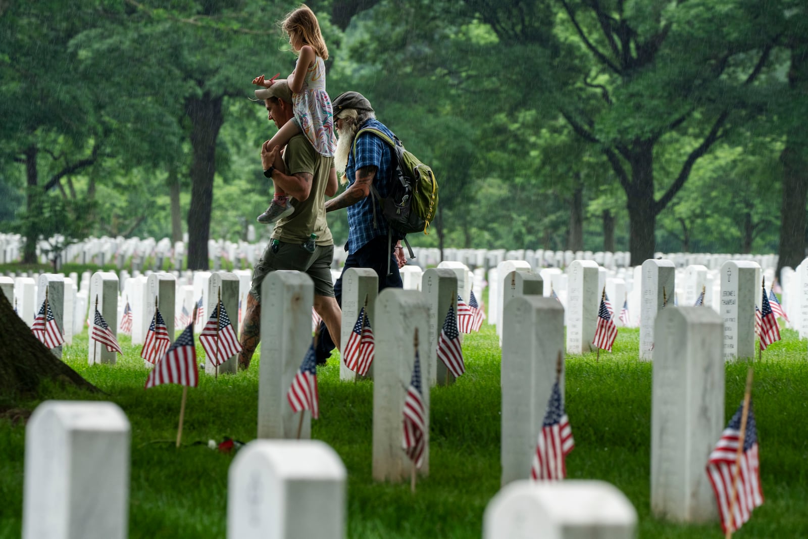 FILE - Families visit Section 60 of Arlington National Cemetery, in Arlington, Va., Monday, May 27, 2024, in honor of Memorial Day. (AP Photo/Jacquelyn Martin, File)