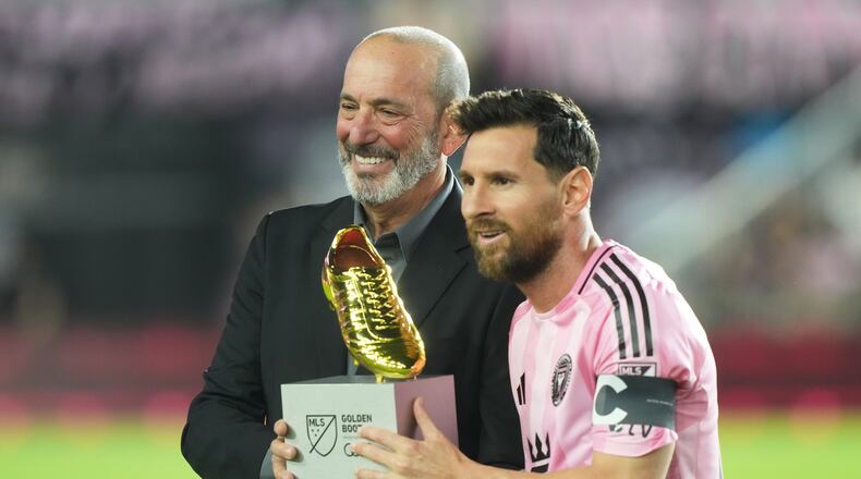 MLS Commissioner Don Garber presents the Golden Boot award to Inter Miami forward Lionel Messi before match one of their MLS playoff opening round soccer match against the Nashville SC, Friday, Oct. 24, 2025, in Fort Lauderdale, Fla. (AP Photo/Marta Lavandier)