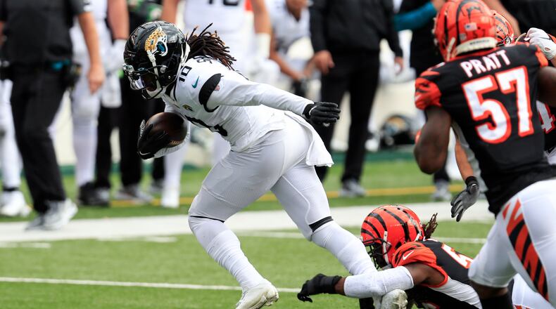 Jacksonville Jaguars wide receiver Laviska Shenault Jr. (10) makes a catch against Cincinnati Bengals middle linebacker Josh Bynes (56) during an NFL football game in Cincinnati, Sunday, Oct. 4, 2020. Cincinnati won 33-25. (AP Photo/Aaron Doster)