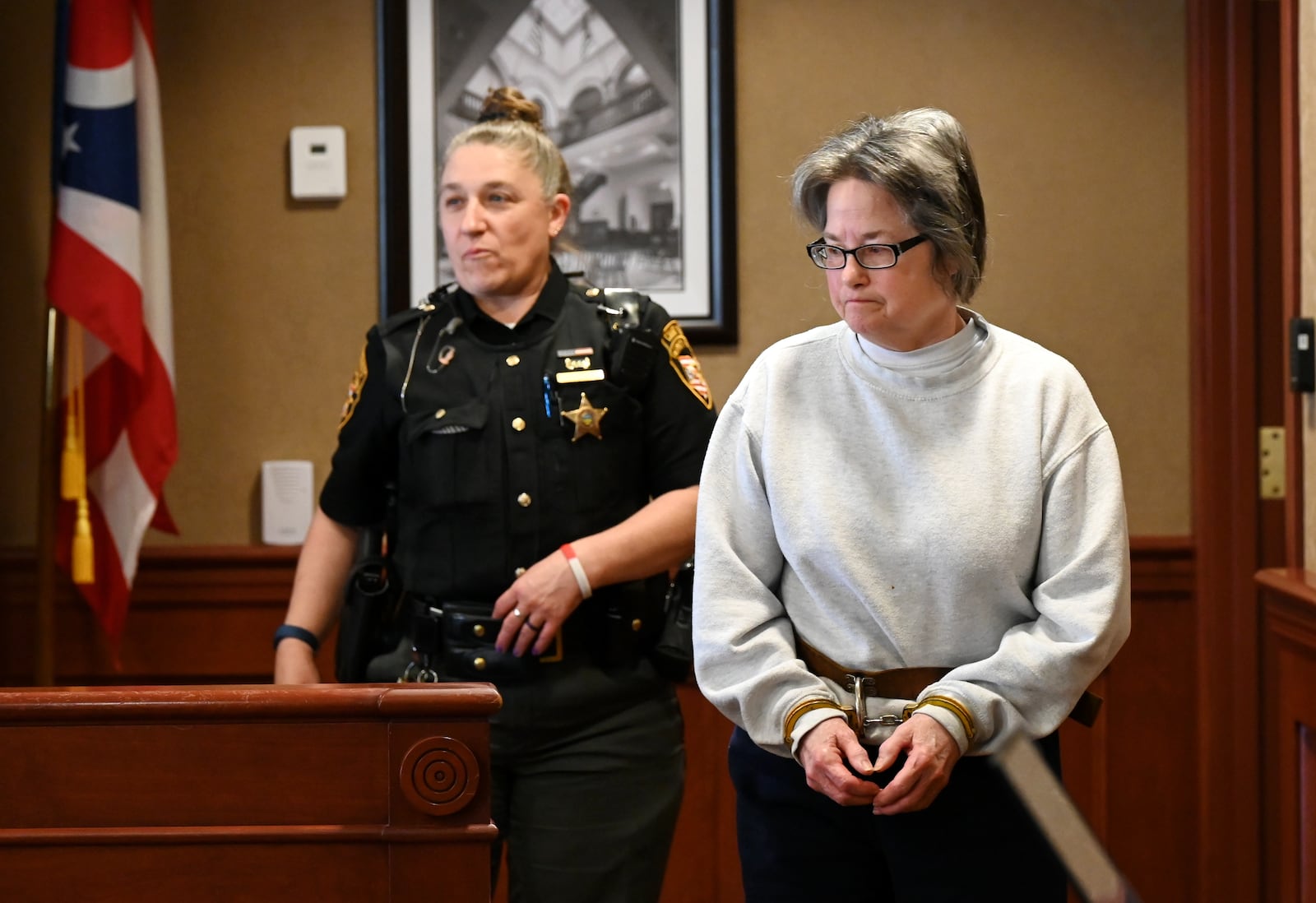 Pamela Sue Harville, 66, is charged with aggravated murder. She's accused of shooting her husband to death on April 2, 2024. Her attorney had since entered insanity plea. She is undergoing mental health treatment in Cincinnati, but Butler County Common Pleas Court Judge Dan Haughey said she's restorable based on her evaluation. Harville is pictured in court on May 16, 2025. MICHAEL D. PITMAN/STAFF