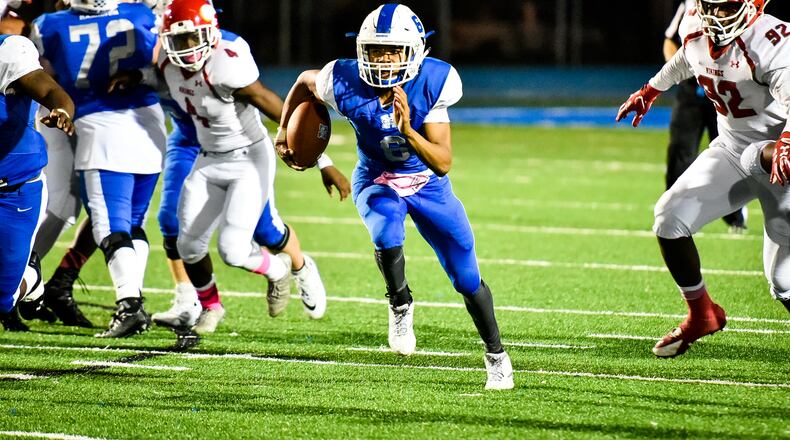 Hamilton quarterback Khaliyal Sowell takes off on a run against Princeton on Oct. 20, 2017, at Virgil Schwarm Stadium in Hamilton. NICK GRAHAM/STAFF