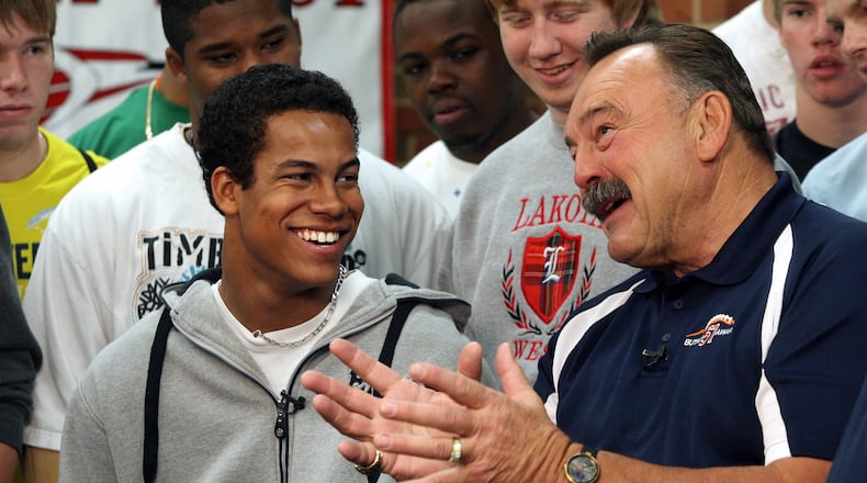 Lakota West High School senior Jordan Hicks talks with former Chicago Bearslinebacker Dick Butkus after receiving the Dick Butkus Award for being the top prep linebacker in the country Dec. 9, 2009, at Lakota West. COX MEDIA FILE PHOTO