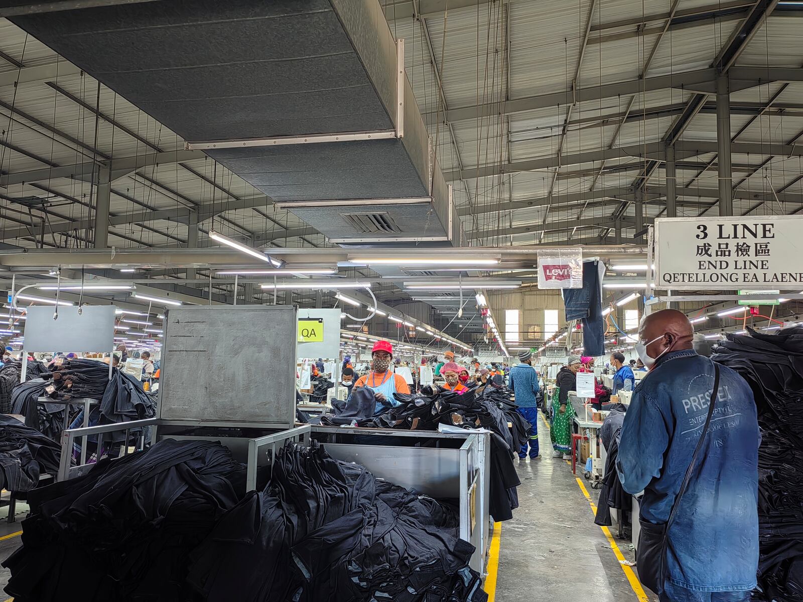 Workers assemble Levi's jeans in the Chinese owned Nien Hsing International factory in Maseru, Lesotho, Wednesday, April 9, 2025. (AP Photo/Keketso Phakela)