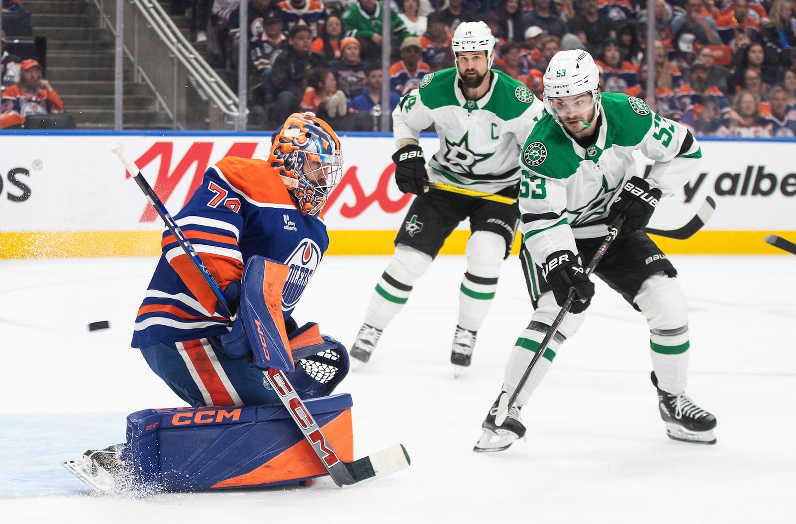 Dallas Stars' Wyatt Johnston (53) is stopped by Edmonton Oilers goalie Stuart Skinner (74) the first period of Game 3 of the NHL hockey Stanley Cup Western Conference final in Edmonton, Alberta, Sunday, May 25, 2025. (Jason Franson/The Canadian Press via AP)