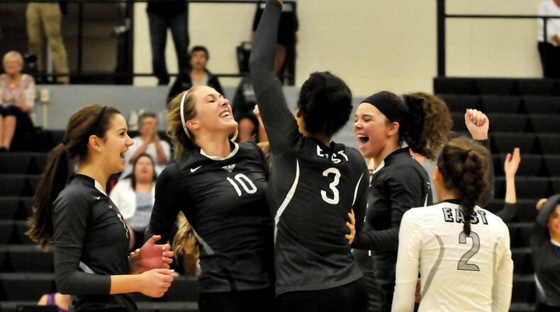 Lakota East players celebrate during a 3-0 victory over visiting Lakota West on Thursday night in Greater Miami Conference volleyball action. CONTRIBUTED PHOTO BY DAVID A. MOODIE