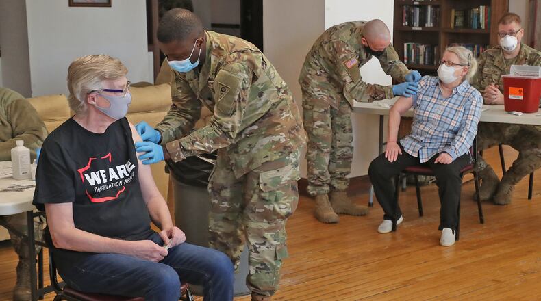 National Guard members give senior residents at Shawnee Place Apartments a COVID vaccine shot Thursday, March 4, 2021, during a clinic set up at the apartments. The clinic is a cooperative effort between the National Guard, the Area Agency on Aging and the Clark County Combined Health District to bring the vaccine to seniors who may not be able to make it to the Clark County clinic at the Upper Valley Mall. BILL LACKEY/STAFF