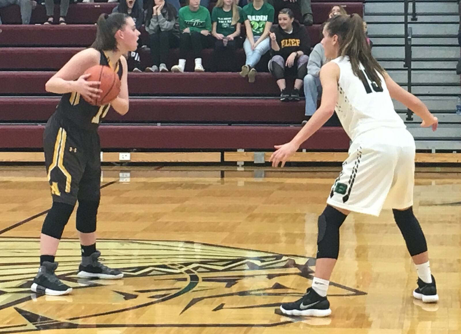 Alter’s Kourtney Klug (14) calls out a play as Badin’s Grace Larkin (15) approaches during Thursday night’s Division II sectional game at Lebanon. RICK CASSANO/STAFF