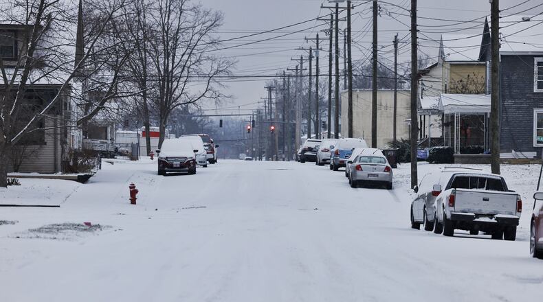 Snow covered the streets of Hamilton, Ohio Jan. 17, 2022. NICK GRAHAM/STAFF