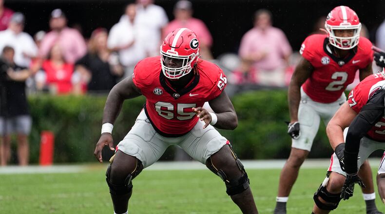 Georgia offensive lineman Amarius Mims (65) is shown aginst SOuth Carolina during the first half of an NCAA college football game Saturday, Sept. 16, 2023, Ga. (AP Photo/John Bazemore)