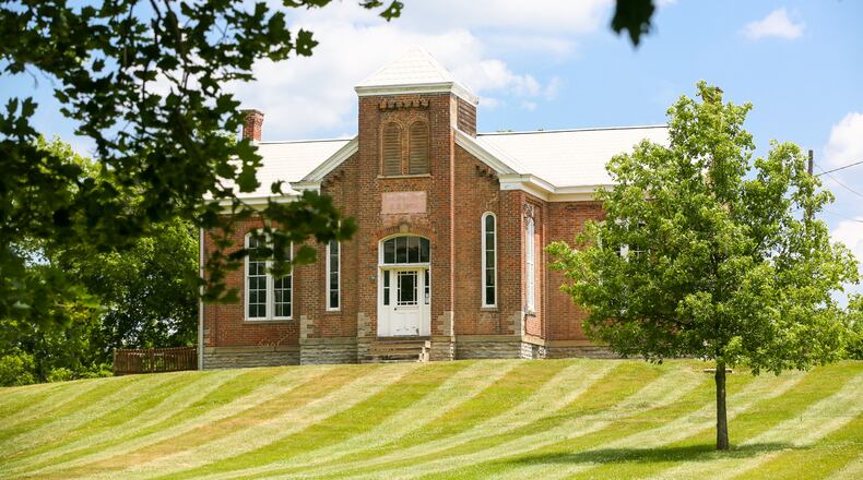 Community Montessori School in Olde West Chester has purchased the historic Station Road Schoolhouse property (pictured) on Station Road. GREG LYNCH / STAFF