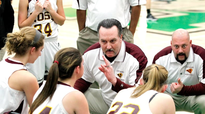 Ross coach Rodney Parrett (middle) talks with his squad during a Division I sectional game against Anderson at Harrison on Feb. 13, 2014. JOURNAL-NEWS FILE PHOTO