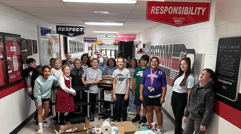 It was a record-breaking year for Lakota Schools’ food drive to help a local food pantry better assist needy families.
The annual “Stuff the Bus” campaign involving Lakota’s 23 schools throughout Liberty and West Chester townships more than doubled its fall 2023 haul of donated food items, school officials recently announced. Pictured are students at Freedom Elementary and their donations. (Contributed/Journal-News)