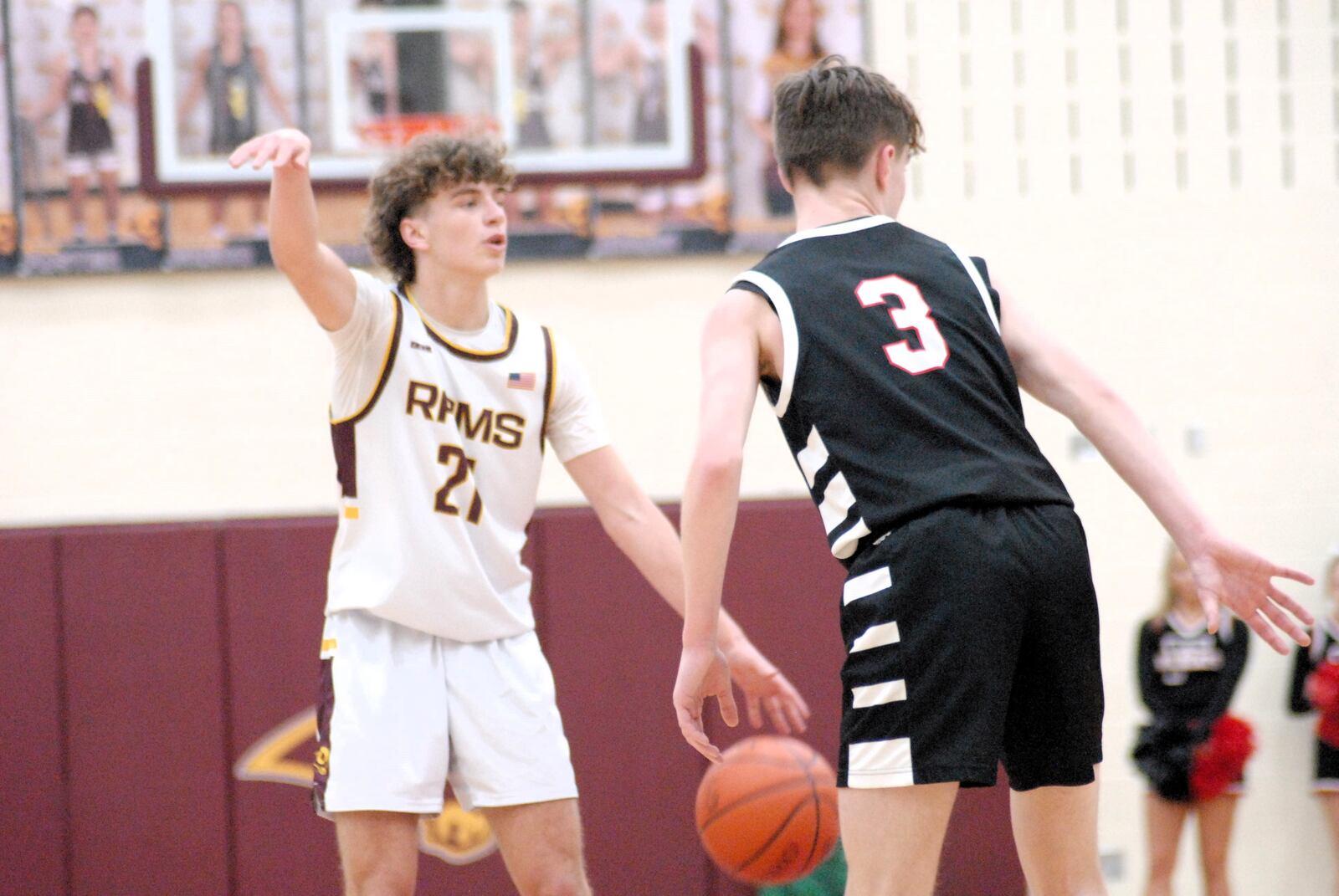 Ross junior Will Schaefer (21) is guarded by Franklin senior Jace Murphy (3) on Friday night. Chris Vogt/CONTRIBUTED