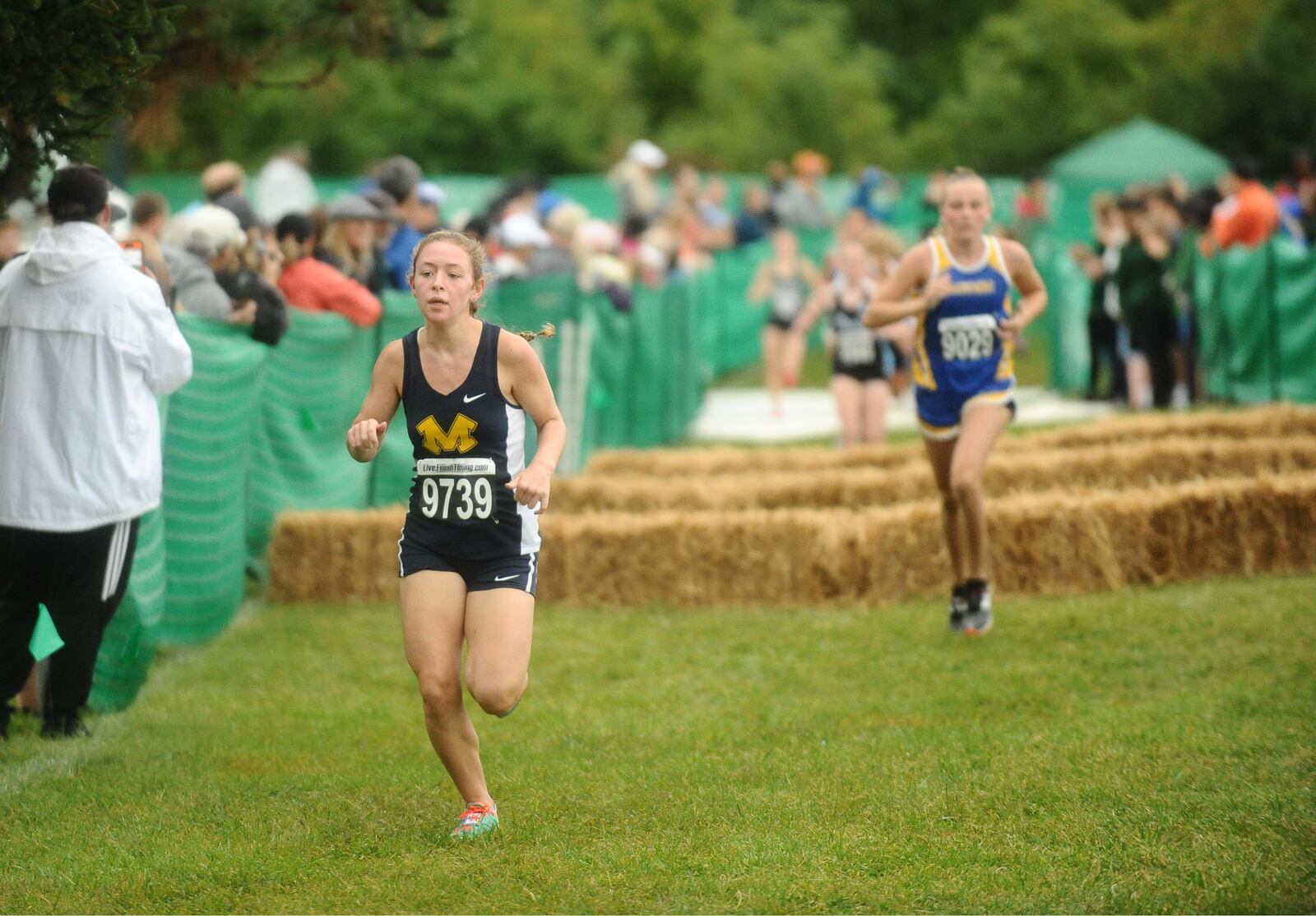 Monroe junior Emily McMurry (left) finished fourth in the Division II girls small school meet at the Mason Invitational on Saturday. McMurry’s time was 20:35. CONTRIBUTED PHOTO BY GREG BILLING