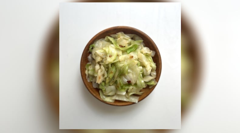 Slightly spicy sauteed cabbage for one takes about 2 minutes to prepare and 8 minutes to cook, and is worth the time as a hearty snack instead of grabbing a meal bar or bag of something that won't be as satisfying. WHITNEY KLING/CONTRIBUTED