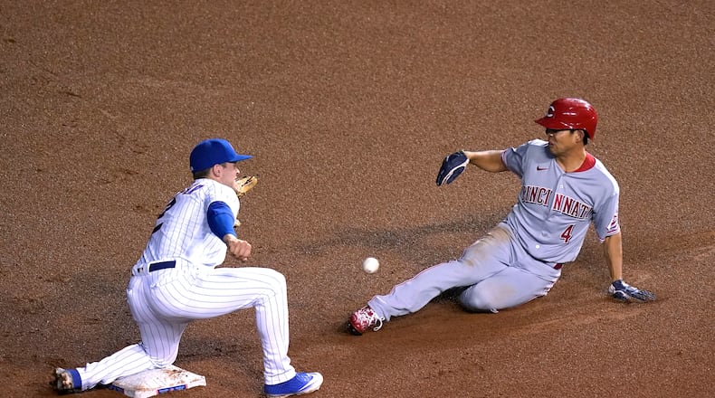 Cincinnati Reds' Shogo Akiyama (4) steals second as Chicago Cubs' Nico Hoerner is unable handle the throw from catcher Willson Contreras during the fourth inning of a baseball game Thursday, Sept. 10, 2020, in Chicago. (AP Photo/Charles Rex Arbogast)