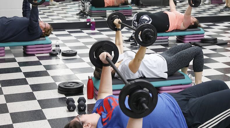 Weight training decreases blood pressure, lowers cholesterol and provides other health benefits. Bill Lackey/Staff