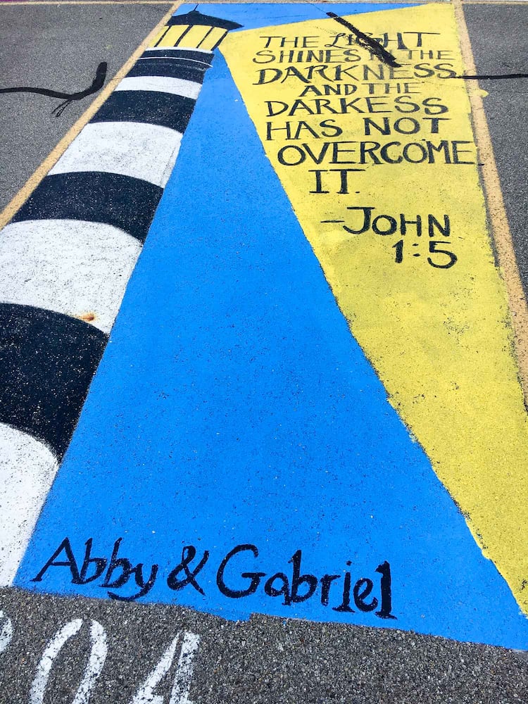 PHOTOS Lakota East seniors paint parking spots