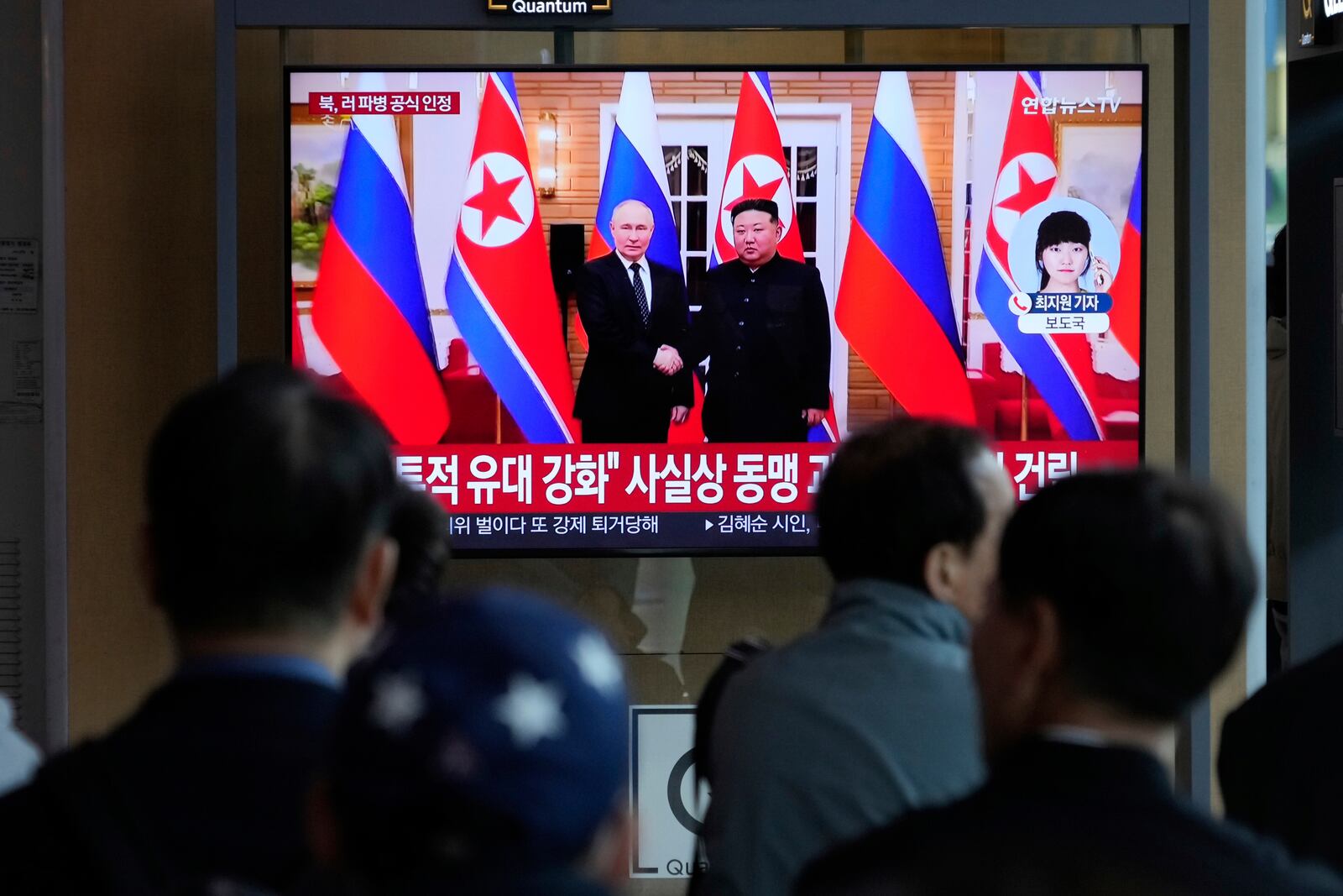 A TV screen shows a file image of North Korean leader Kim Jong Un, right, and Russian President Vladimir Putin in Pyongyang, during a news program at the Seoul Railway Station in Seoul, South Korea, Monday, April 28, 2025.(AP Photo/Ahn Young-joon)