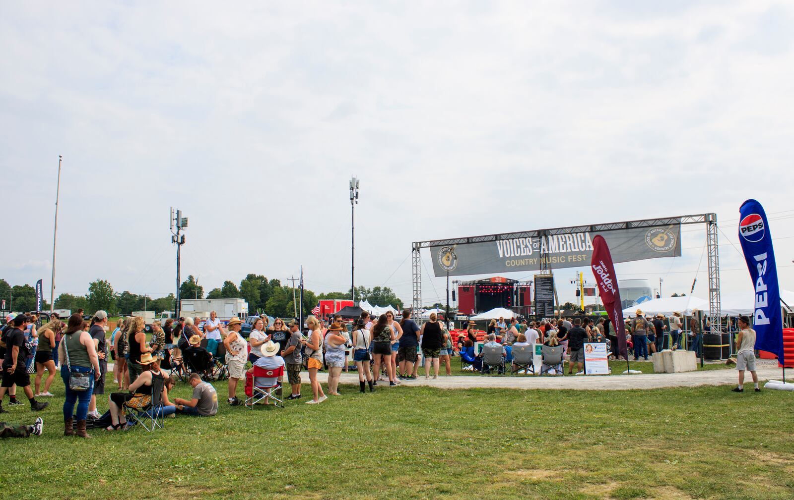 Concert goers attend the first day of the Voices of America Country Music Fest on the grounds of the National Voice of American Museum of Broadcasting Thursday, Aug. 8, 2024 in West Chester Township. KASEY TURMAN/STAFF