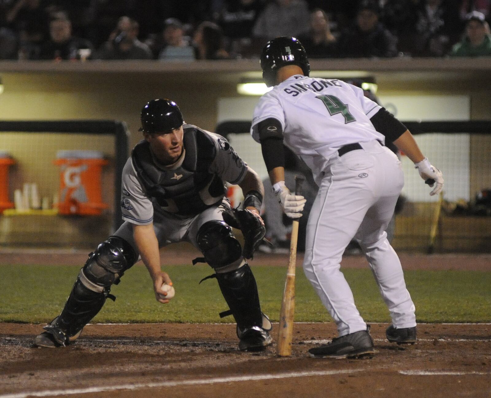 Whitecaps catcher Austin Athmann tags out John Sansone of the Dragons. The Dragons defeated the West Michigan Whitecaps (Tigers) 10-8 in a Class A minor-league baseball game at Daytonâs Fifth Third Field on Wednesday, April 12, 2017. MARC PENDLETON / STAFF