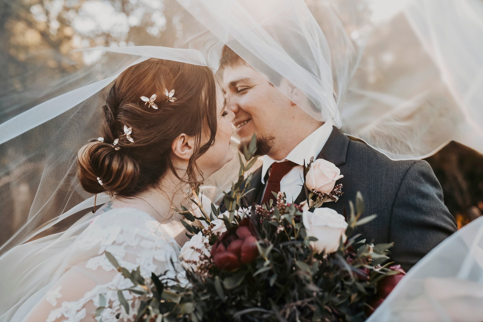 Anna and Garrick Hanney embrace on their wedding day in Krum, Texas on Oct. 19, 2024. (April Pinto Photography via AP)