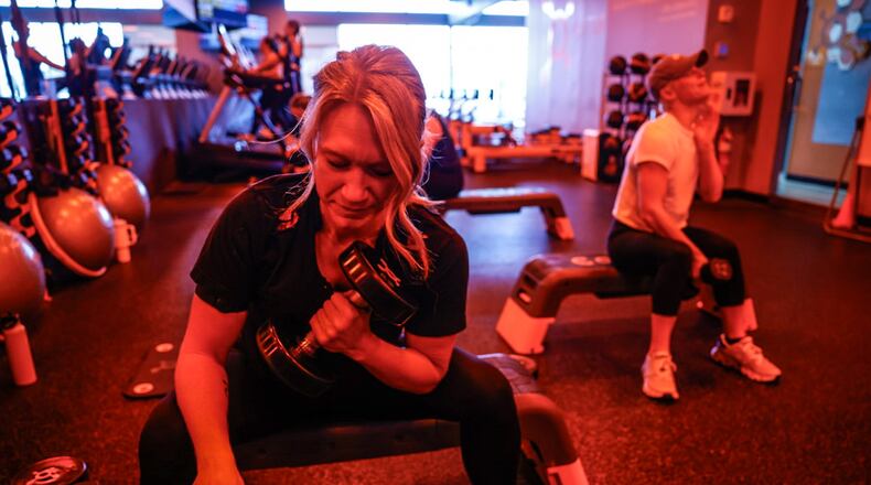 Sarah Geiselman works out at Orangetheory Fitness on North Fairfield Road in Beavercreek. JIM NOELKER/STAFF