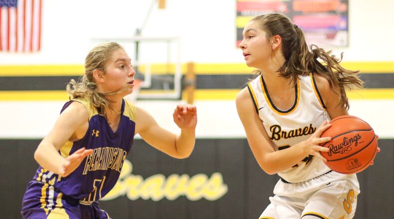 Mechanicsburg junior Grace Forrest guards Shawnee sophomore Zoe Ballard during their game earlier this season in Springfield. CONTRIBUTED PHOTO BY MICHAEL COOPER