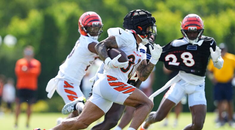 Cincinnati Bengals running back Chase Brown (30) runs during practice at the team's NFL football training camp, Sunday, July 27, 2025, in Cincinnati. (AP Photo/Jeff Dean)