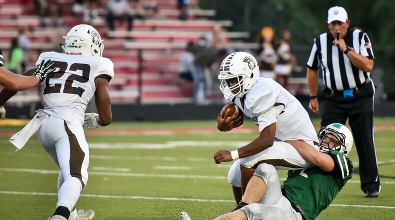 Badin’s Bryce Holian sacks Roger Bacon quarterback Tyler Bullock during their Sept. 22, 2017 game at Fairfield Stadium in Fairfield. Badin won 41-21. NICK GRAHAM/STAFF