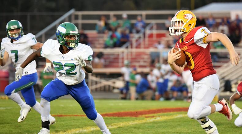 Fenwick’s Jack Fessler (3) prepares to sprint past Chaminade Julienne’s Jason Ward (22) and Brendan Kadel (7) for his second touchdown of the night during an Oct. 5 game at Krusling Field in Middletown. The host Falcons won 34-19. CONTRIBUTED PHOTO BY ANGIE MOHRHAUS