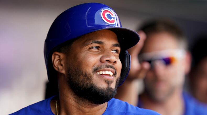 Chicago Cubs' Jeimer Candelario celebrates in the dugout after he hit a two-run home run against the Pittsburgh Pirates in the fourth inning of a baseball game in Pittsburgh, Sunday, Aug. 27, 2023. (AP Photo/Matt Freed)