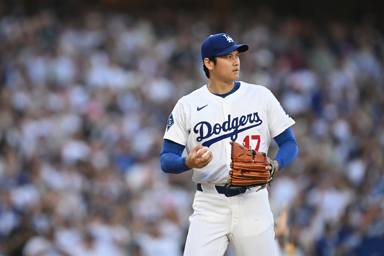 Los Angeles Dodgers starting pitcher Shohei Ohtani prepares to pitch during the first inning of a baseball game against the San Diego Padres, Monday, June 16, 2025, in Los Angeles. (AP Photo/Kyusung Gong)
