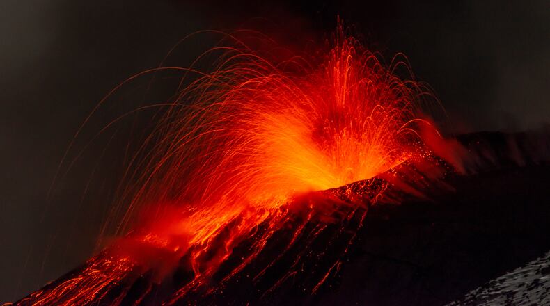 Explosive activity concentrates at the north-east crater of the Mount Etna, as an eruption started on Dec. 24 continues, in Sicily, Italy, Monday Dec. 29, 2025. (AP Photo/Salvatore Allegra)