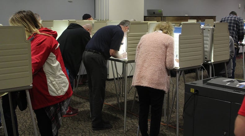 Voters cast their votes at the First Christian Church on Middle Urbana Road in 2018. Eric Higgenbotham/STAFF