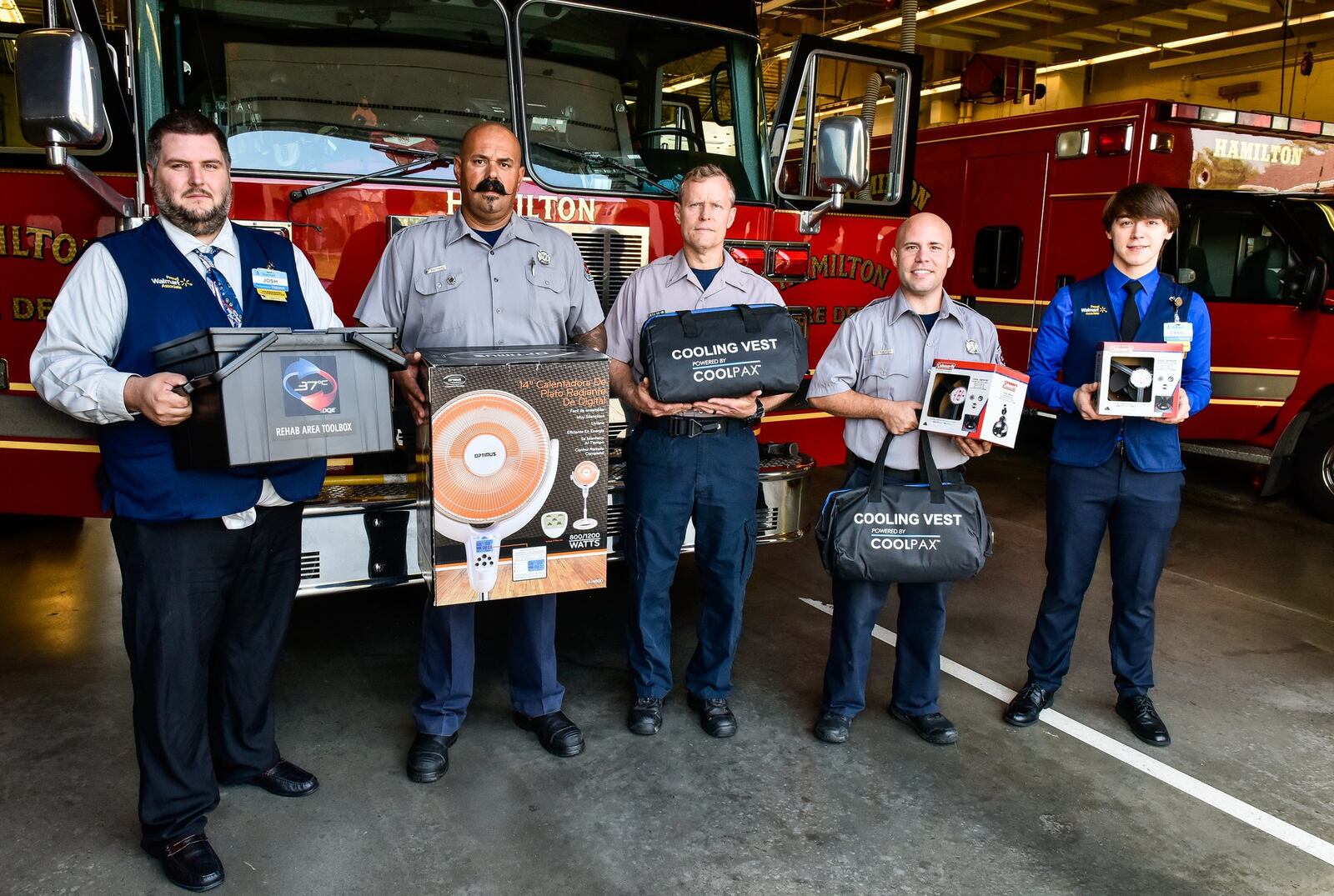 The Hamilton Walmart donated more than $2,000 worth of equipment to the Hamilton Fire Department to help keep firefighters safe in extreme weather conditions. Pictured (from left) are: Joshua Lane, Walmart personnel coordinator; Hamilton firefighter Terry Southard; Hamilton fire Lt. Jeff Blair; Hamilton firefighter Tony Robertson; and Daniel George, Walmart Assistant Manager. NICK GRAHAM/STAFF